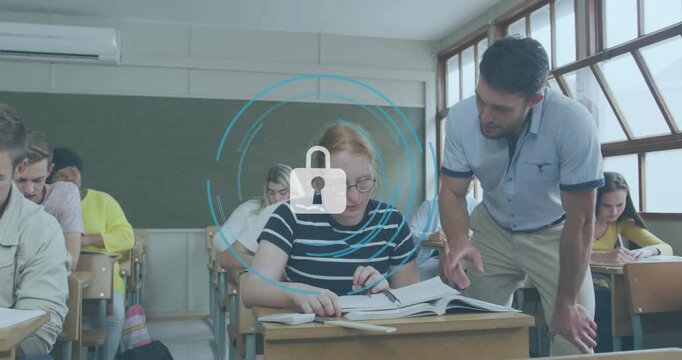 Teacher leaning and pointing causing rings padlock to teach in classroom while student taking notes