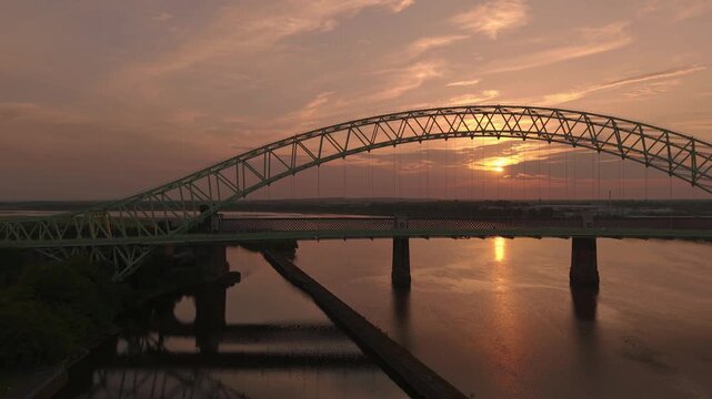 Liverpool, Merseyside, UK, September 09, 2025; aerial 4K video footage of the Silver Jubilee Bridge and Britannia Railway Viaduct over the River Mersey and Manchester Ship Canal, Runcorn, Merseyside