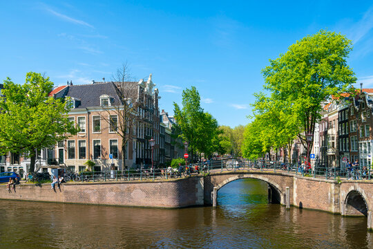 Typical houses and bridge on intersection of Keizersgracht and Reguliersgracht canals,  Amsterdam, Netherlands