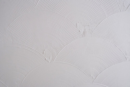 White Textured Wall with Decorative Fan Swirl Plaster Pattern, Artex Ceiling Background, Modern Interior Renovation Surface