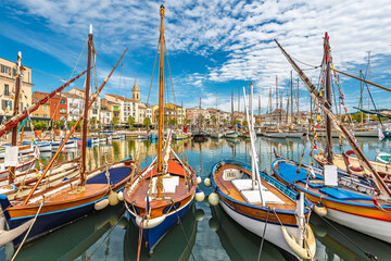 Scenic view of Sanary sur Mer in south of France and its fishermen boats against dramatic summer sky