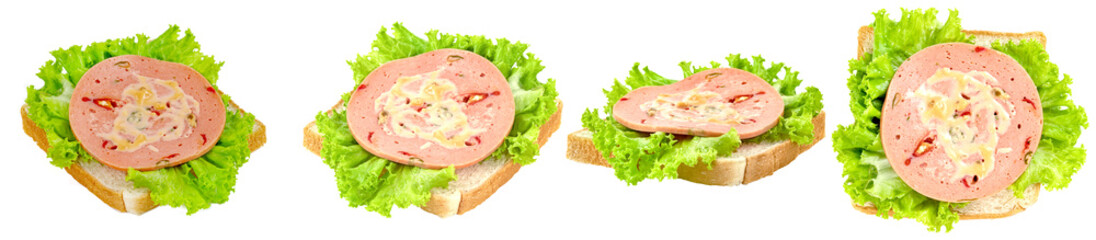 appetizing selection of open-faced sandwiches with bologna sausage and fresh green lettuce, ready for a quick meal. © Food and Drink