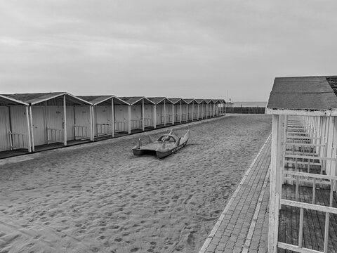 Ostia, Rome, Italy - March 4, 2026, a pedalo parked on the beach, between the cabins of a beach resort.