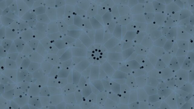Aerial view of a speckled gray surface with scattered black dots forming a circular pattern