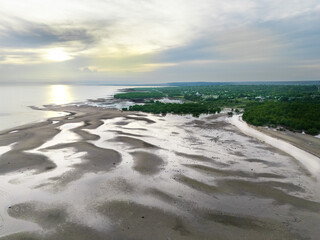 The calm atmosphere of the morning as the sun begins to appear on the eastern horizon of Sumba, near the mouth of the Payeti River, directly facing the Waingapu sea © HeinrichDengi