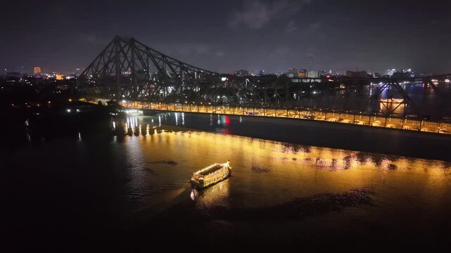 Aerial Night View of Howrah Bridge and Ferry River Kolkata, India