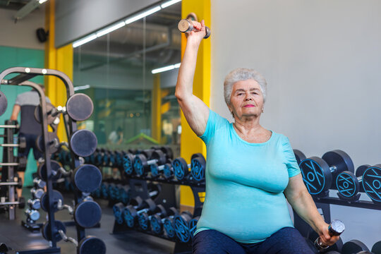Strong Senior Woman 75+ Lifting Dumbbells at Gym - Shoulder Strength and Osteoporosis Prevention. age-authentic fitness, no-shame aging, empowered elderly lifestyle