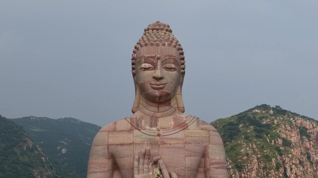 Aerial View of Giant Buddha Statue in Lake Surrounded by Hills Rajgir Bihar India