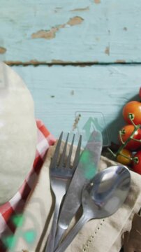 Vertical video: Camera panning revealing cutlery centered, holograms floating over food for ads