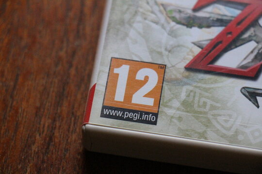 PEGI and CERO game ratings on different videogames. American, European and Japanese age rating marks