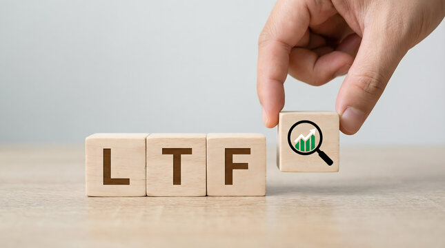LTF Acronym on Wooden Blocks with Magnifying Glass and Growth Chart Icon