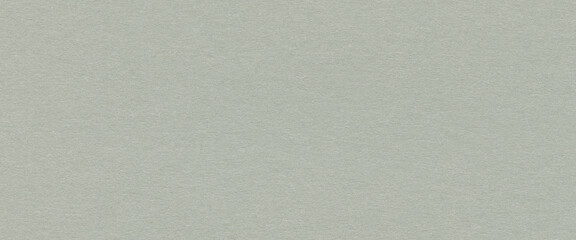 Close up of light green paper texture with subtle fibers and rough surface for creative design. Blank background with natural pattern