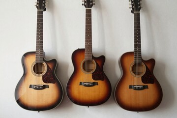 Obraz premium Three Acoustic Guitars in a Row
