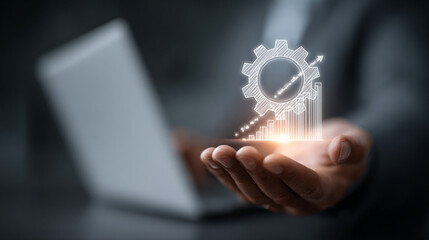 Business professional presenting glowing gear system with upward arrows above open palm, laptop background, symbolizing workflow automation, productivity boost and buisness growth strategy