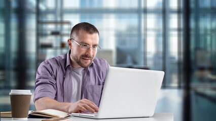 Portrait of professional business man employee using laptop