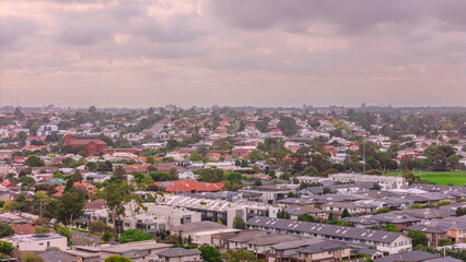 Obraz premium Panoramic Aerial Drone view of Inner Suburbs of Melbourne housing, roof tops, the streets and the parks, the roads and trees of Ascot Vale Moonee Ponds Brunswick Essendon and Maribyrnong in VIC Victor