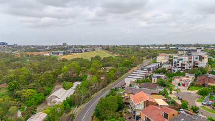 Naklejka premium Panoramic Aerial Drone view of Inner Suburbs of Melbourne housing, roof tops, the streets and the parks, the roads and trees of Ascot Vale Moonee Ponds Brunswick Essendon and Maribyrnong in VIC Victor