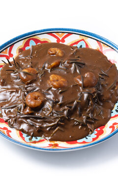 Mexican romeritos with mole sauce and shrimp isolated on white background