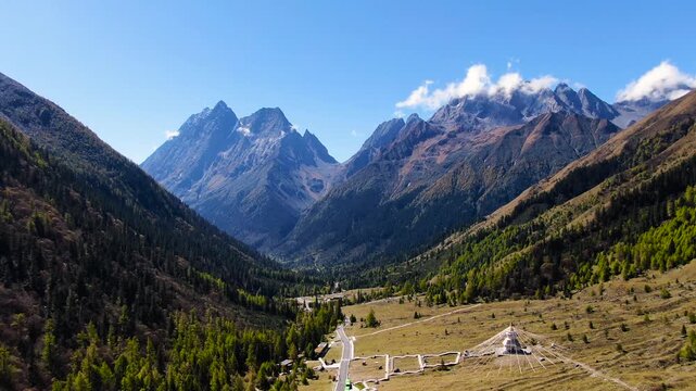 Sichuan Mountain Valley with Snow Peaks and Alpine Forest