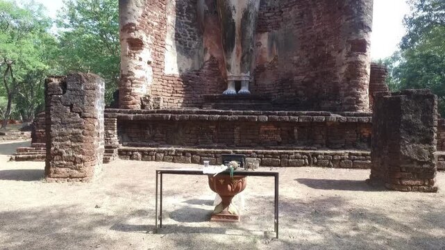 Ancient standing Buddha statue at Wat Phra Si Iriyabot, Kamphaeng Phet Historical Park, Thailand.