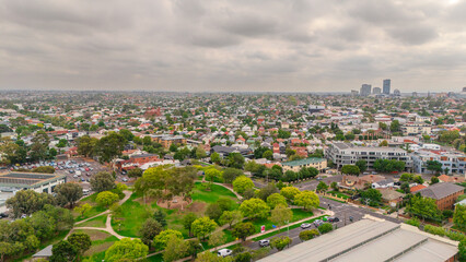 Obraz premium Panoramic Aerial Drone view of Inner Suburbs of Melbourne housing, roof tops, the streets and the parks, the roads and trees of Ascot Vale Moonee Ponds Brunswick Essendon and Maribyrnong in VIC Victor