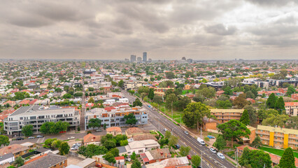 Obraz premium Panoramic Aerial Drone view of Inner Suburbs of Melbourne housing, roof tops, the streets and the parks, the roads and trees of Ascot Vale Moonee Ponds Brunswick Essendon and Maribyrnong in VIC Victor