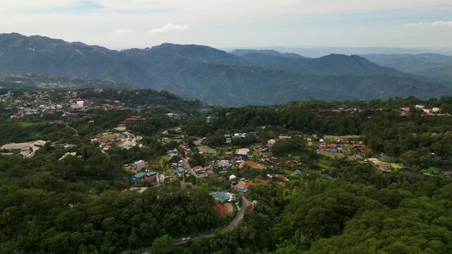 Aerial View Of Village Surrounded With Lush Vegetation And Mountains In La Trinidad, Benguet, Philippines - Drone Shot