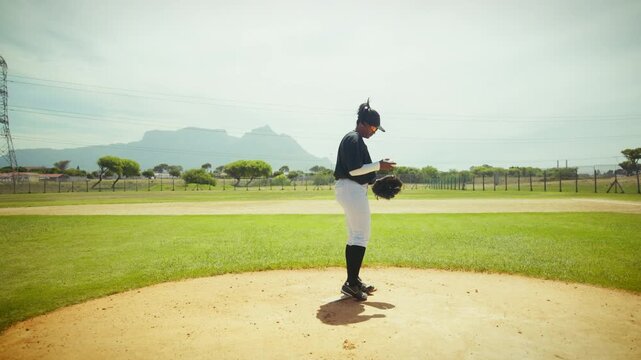 Pitcher prepares to throw a baseball on the mound