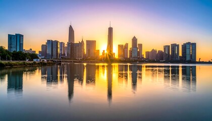 Obraz premium Sunlit city skyline reflecting on calm water at dawn, golden light, serene and majestic