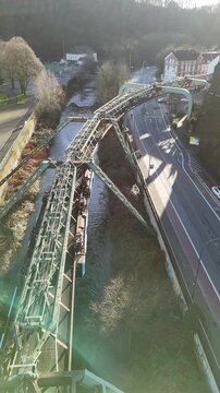 Suspended railway train over Wupper River Wuppertal Germany