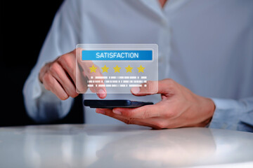 Customer satisfaction rating concept with five star review feedback on smartphone screen. User giving online rating via mobile app. Service quality evaluation, review system and customer experience