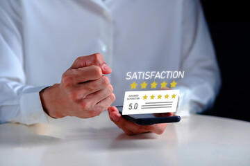 Customer satisfaction concept showing five star rating and positive feedback on smartphone screen. Business user celebrating excellent review score. Online service evaluation, customer experience