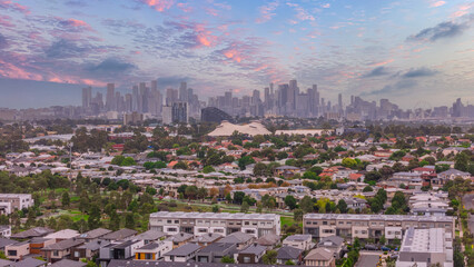 Fototapeta premium Panoramic Aerial Drone view of Inner Suburbs of Melbourne housing, roof tops, the streets and the parks, the roads and trees of Ascot Vale Moonee Ponds Brunswick Essendon and Maribyrnong in VIC Victor