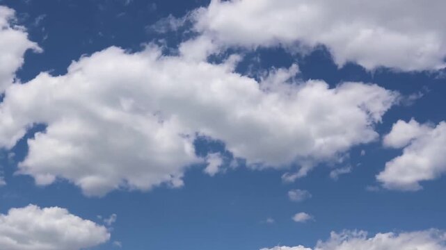 Bright Blue Sky with Fluffy White Clouds