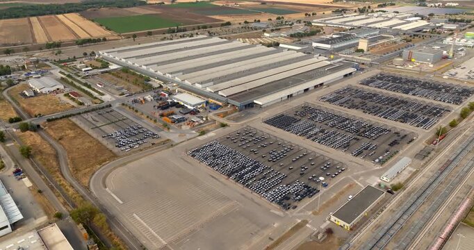 Aerial view of the Fiat car factory and production facilities located in the industrial area of ​​San Nicola, near Melfi, Basilicata, Italy. A large industrial complex with extensive parking lots.