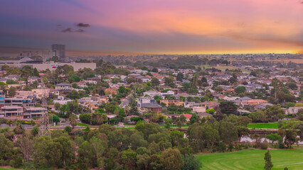 Fototapeta premium Panoramic Aerial Drone view of Inner Suburbs of Melbourne housing, roof tops, the streets and the parks, the roads and trees of Ascot Vale Moonee Ponds Brunswick Essendon and Maribyrnong in VIC Victor
