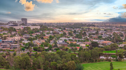 Fototapeta premium Panoramic Aerial Drone view of Inner Suburbs of Melbourne housing, roof tops, the streets and the parks, the roads and trees of Ascot Vale Moonee Ponds Brunswick Essendon and Maribyrnong in VIC Victor