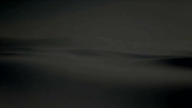 Serene Waves Undulating in a Dark Ocean Scene