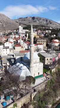 Drone aerial view of Stari Most (Old Bridge) and Koski Mehmed Pasha Mosque in Mostar, Bosnia and Herzegovina