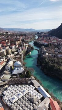 Drone aerial view of Stari Most (Old Bridge) and Koski Mehmed Pasha Mosque in Mostar, Bosnia and Herzegovina