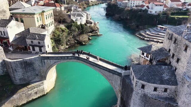 Drone aerial view of Stari Most (Old Bridge) and Koski Mehmed Pasha Mosque in Mostar, Bosnia and Herzegovina
