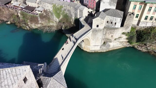 Drone aerial view of Stari Most (Old Bridge) and Koski Mehmed Pasha Mosque in Mostar, Bosnia and Herzegovina