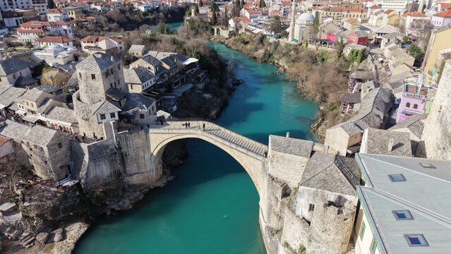 Drone aerial view of Stari Most (Old Bridge) and Koski Mehmed Pasha Mosque in Mostar, Bosnia and Herzegovina