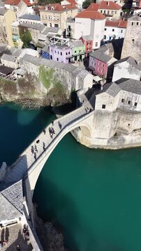 Drone aerial view of Stari Most (Old Bridge) and Koski Mehmed Pasha Mosque in Mostar, Bosnia and Herzegovina