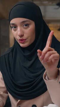 Arabian business woman in hijab businesswoman shking finger no laptop using negative Islamic female girl Muslim worker office manager working online computer browsing waving not never gesture refuse