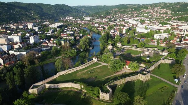 Cinematic drone video showcases the Vrbas river and ancient Kastel fortress walls in Banja Luka, Bosnia and Herzegovina. Aerial perspective, Balkan historic landmark.
