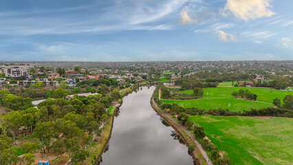 Naklejka premium Panoramic Aerial Drone view of Inner Suburbs of Melbourne housing, roof tops, the streets and the parks, the roads and trees of Ascot Vale Moonee Ponds Brunswick Essendon and Maribyrnong in VIC Victor