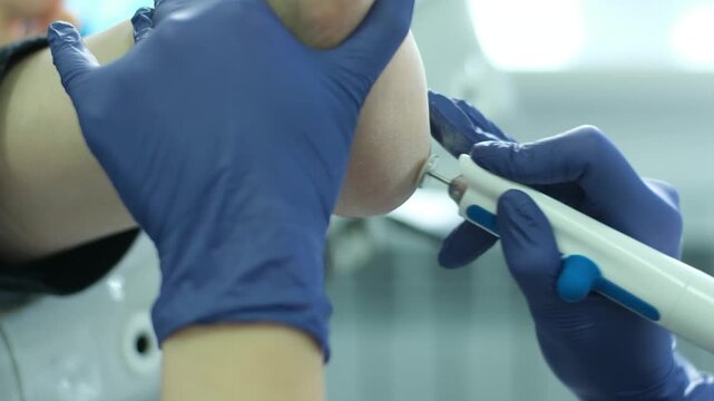 Removal of the hard keratinized layer from the heel skin using the grinding tool. Podology and pedicure. Foot care. High quality 4k footage
