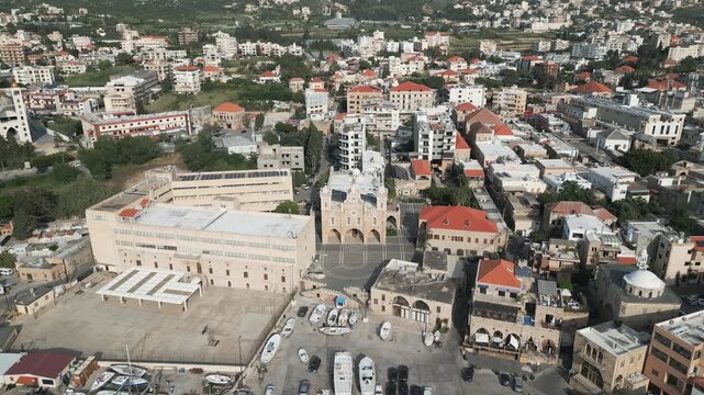 Aerial lateral drone video unveiling panoramic view of Batroun, an authentic Mediterranean coastal town located in northern Lebanon.
