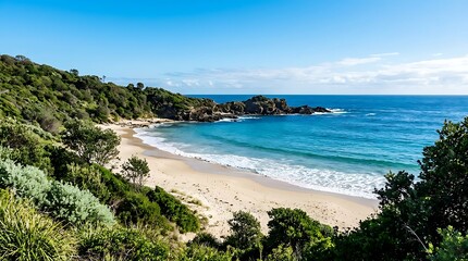 Naklejka premium A serene beach surrounded by lush greenery and rugged coastline on a sunny day